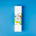 Box of natural fragrance oils on a blue background